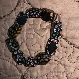 Black and floral bracelet.